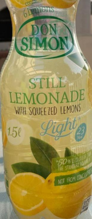 Fotografie - Still lemonade with squeezed lemons light Don Simon