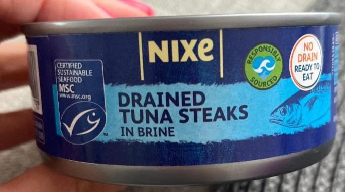 Fotografie - Drained tuna steaks in brine Nixe